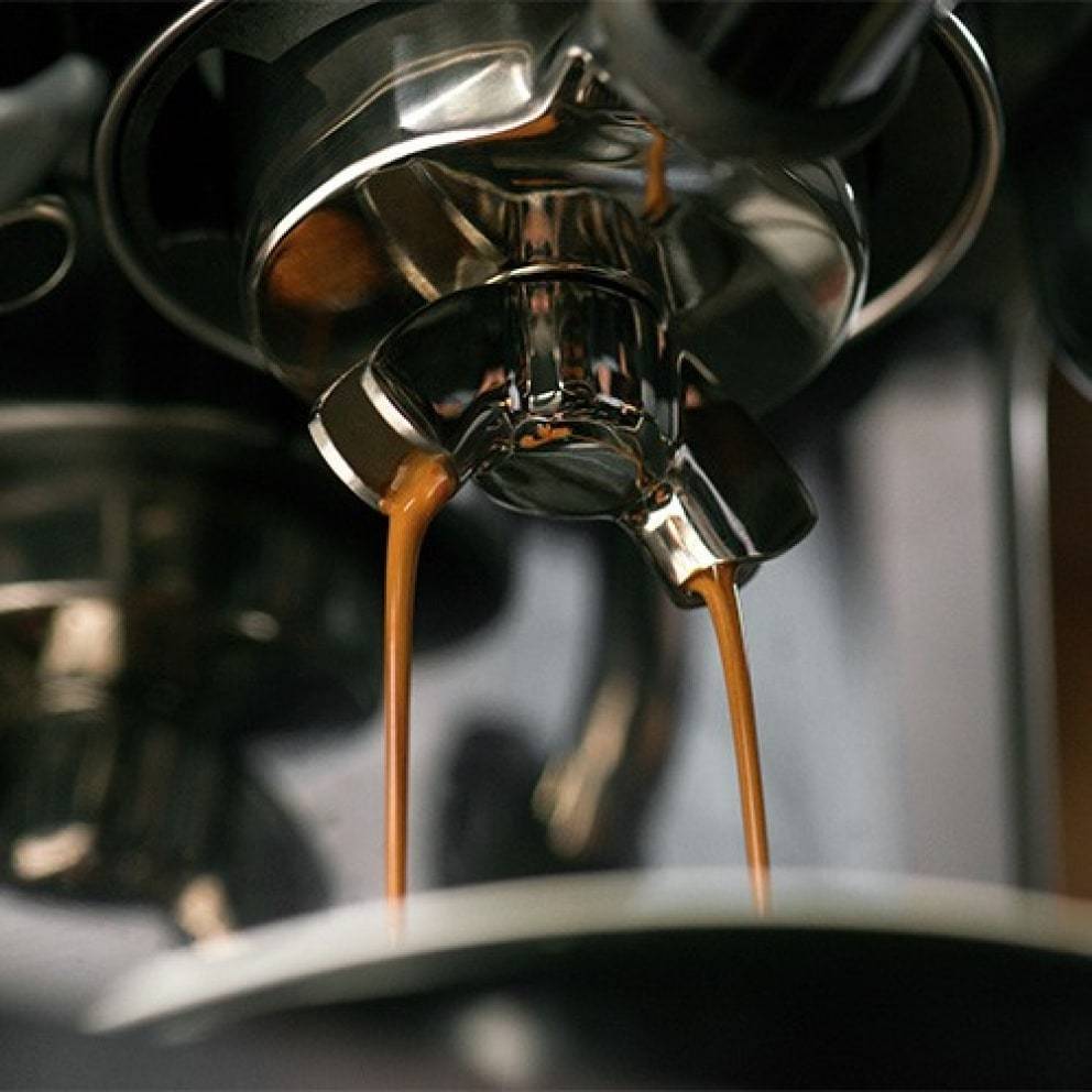 Sage Barista Touch Black Truffle Espresso Machine pouring an espresso
