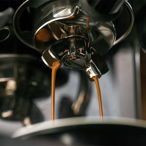 Sage Barista Touch Black Truffle Espresso Machine pouring an espresso